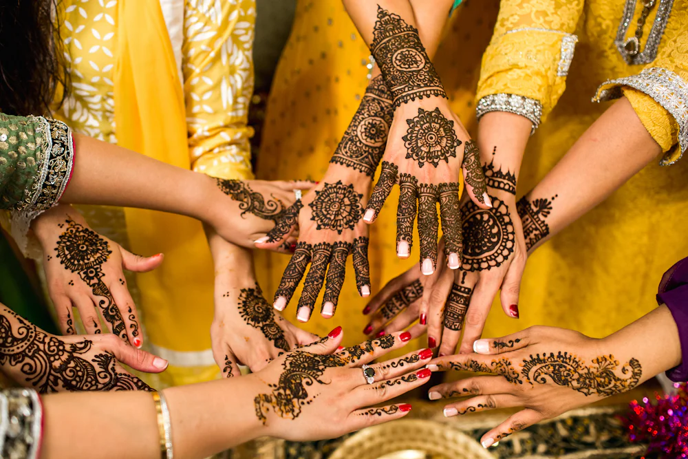 Hands decorated with intricate henna patterns